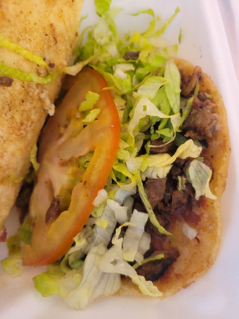 Close-up of two tacos with vegetables